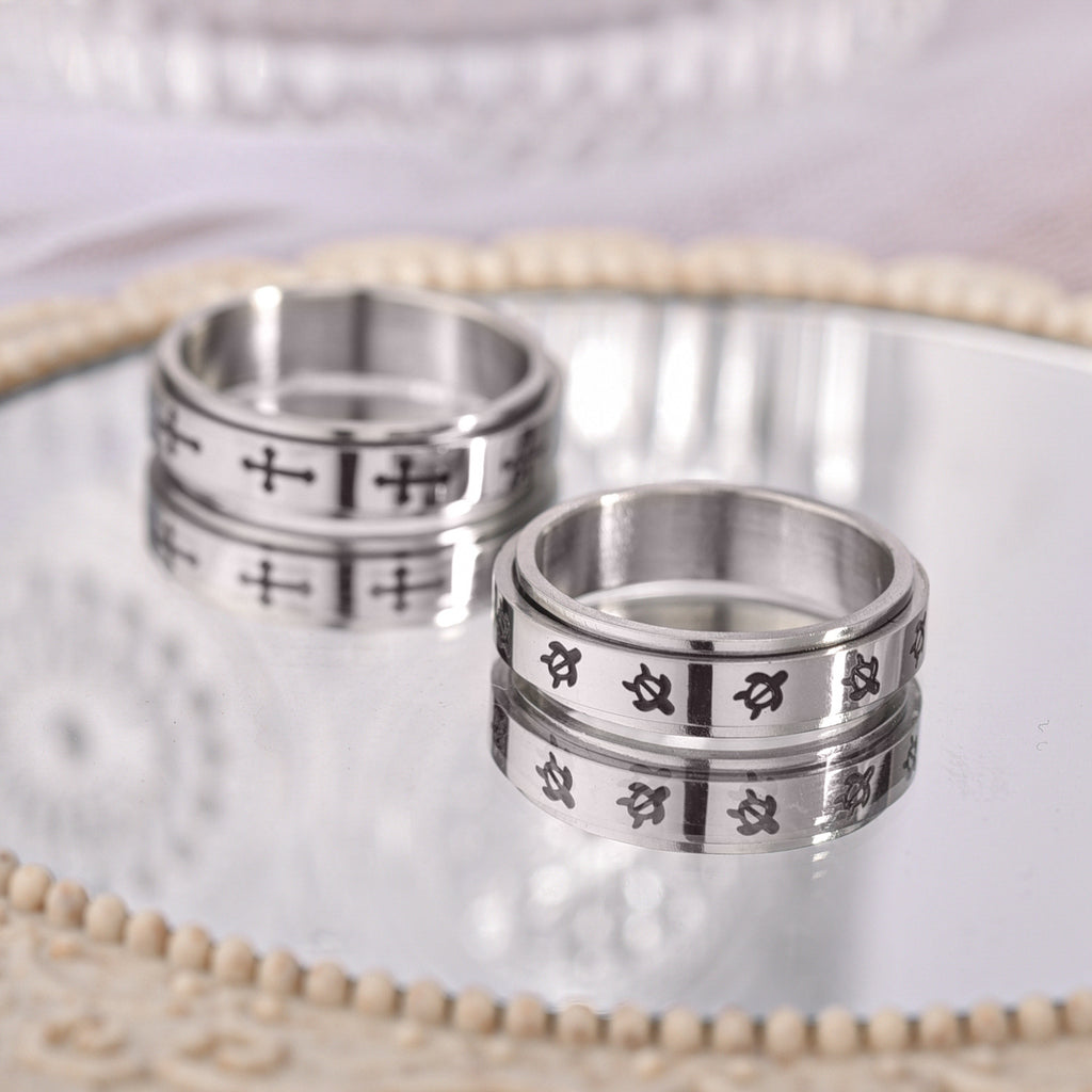 Anti-anxiety and stress-reducing rotating cross ring
